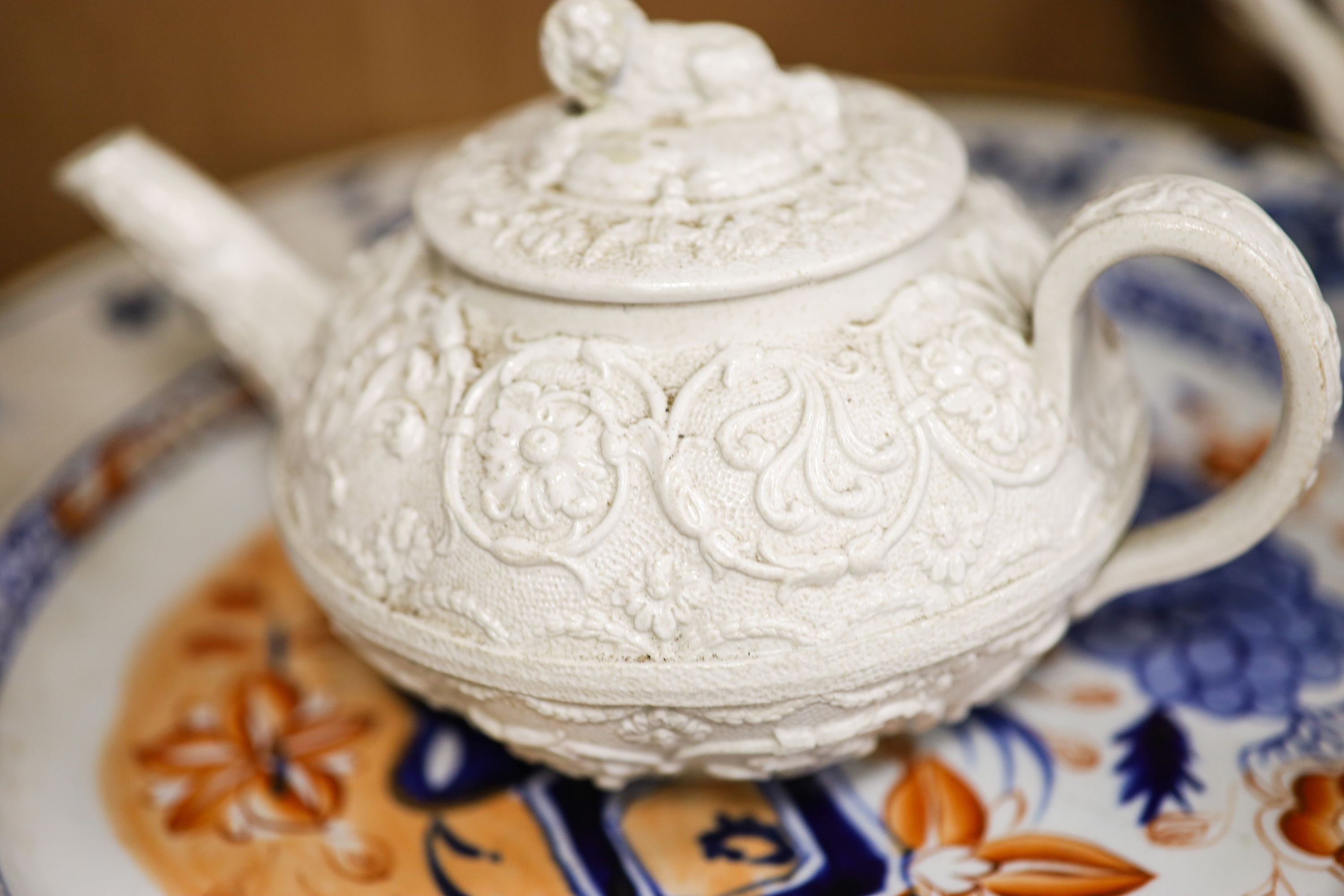 Nine pieces of Victorian Masons Ironstone, five Hydra jugs, a Delft charger and relief moulded teapot.